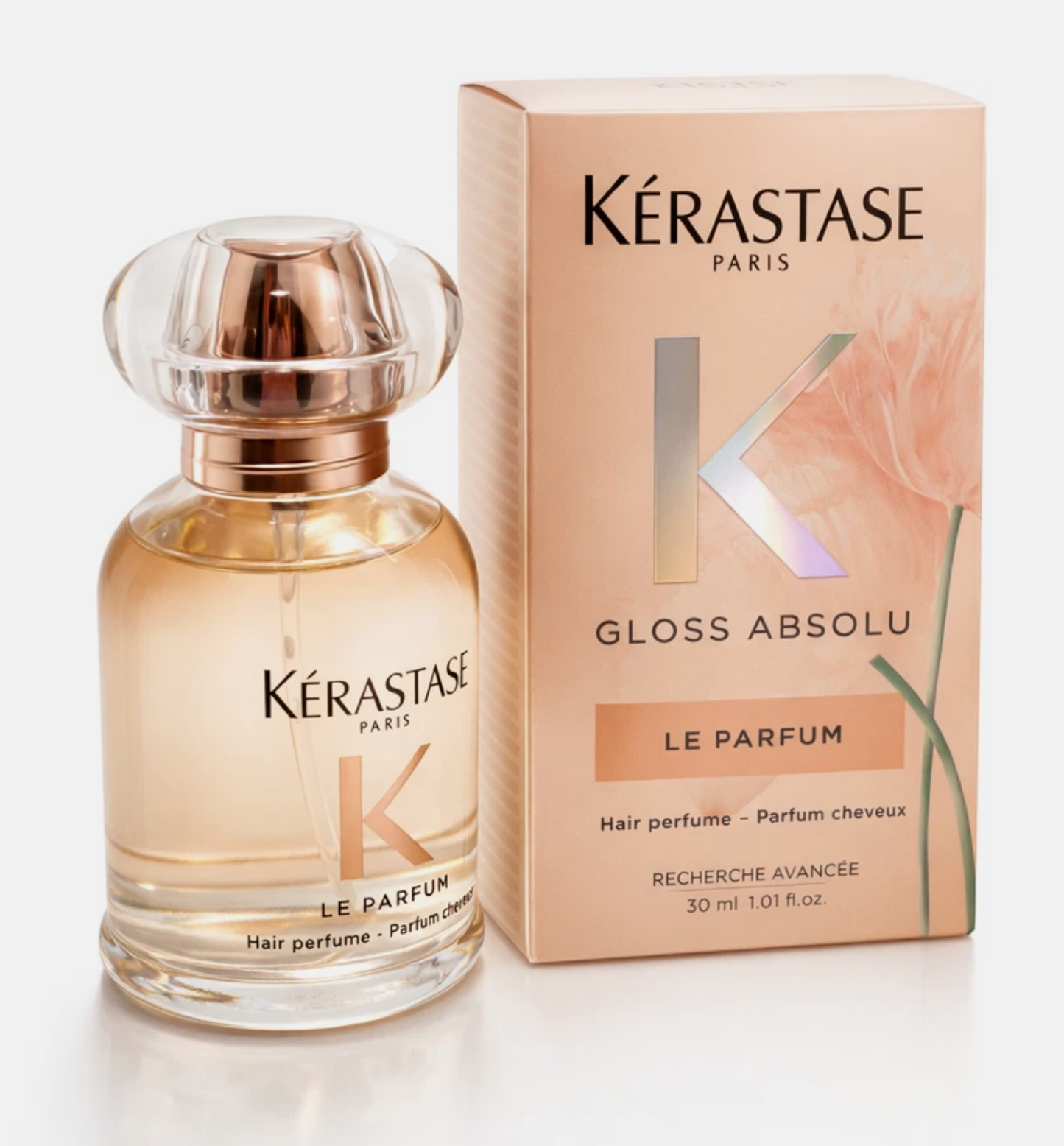 Kérastase Gloss Absolu hair perfume bottle and packaging on a light background